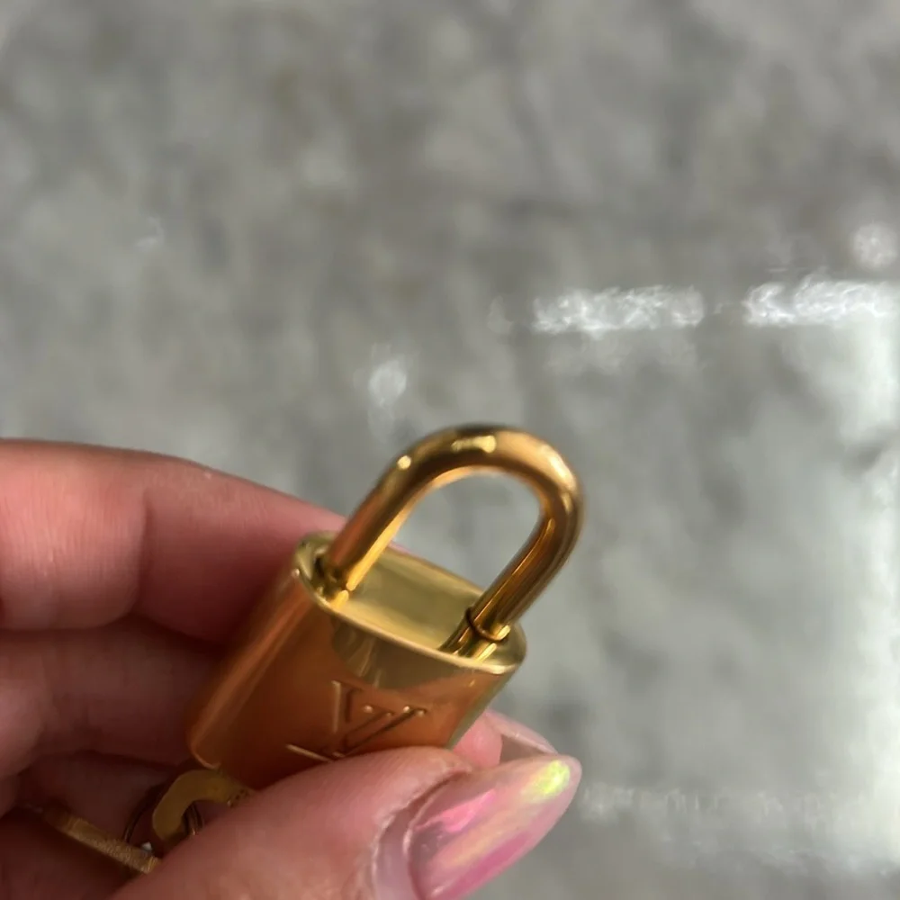 Louis Vuitton Gold Padlock and Key Set